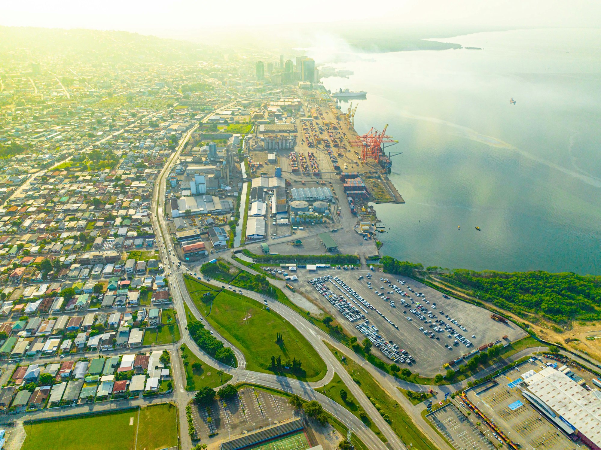 Aerial view of Port of Spain, Trinidad and Tobago, with houses, a container port and the waterfront
