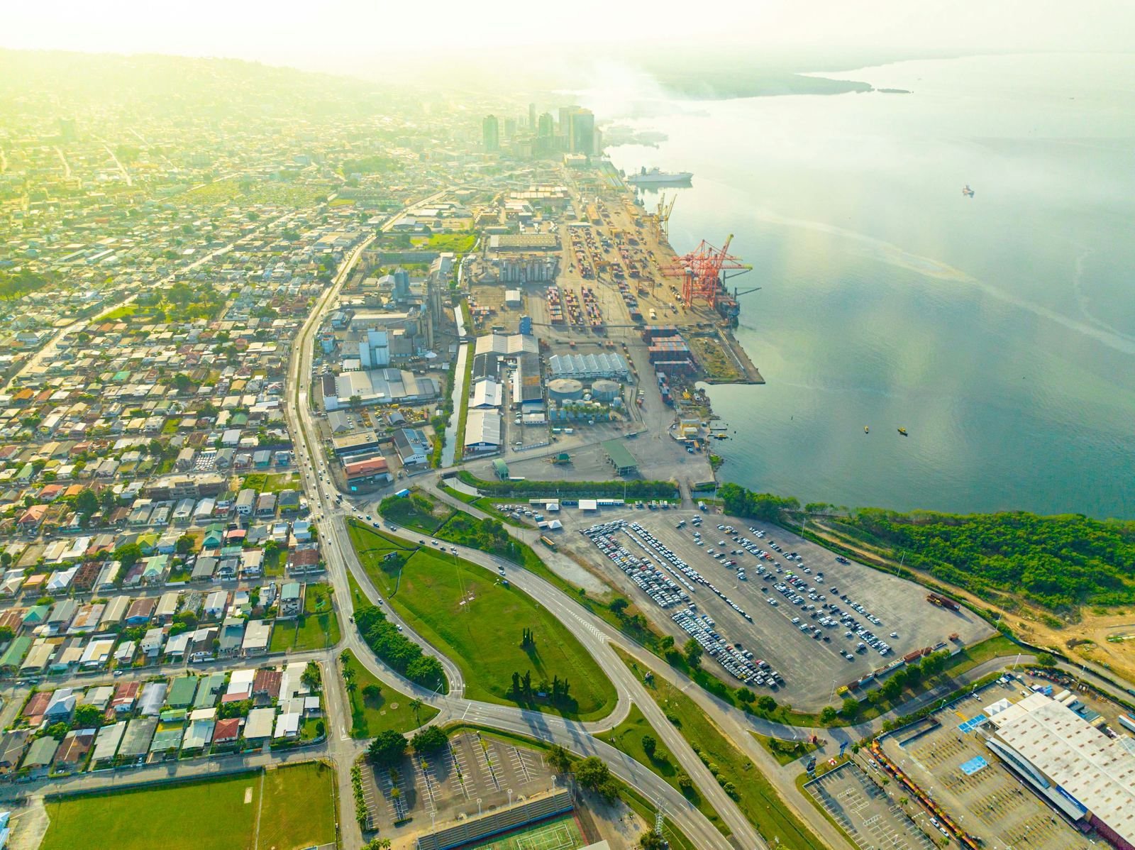 Aerial view of the Port of Spain waterfront, Trinidad, with the city skyline, port cranes and the Gulf of Paria